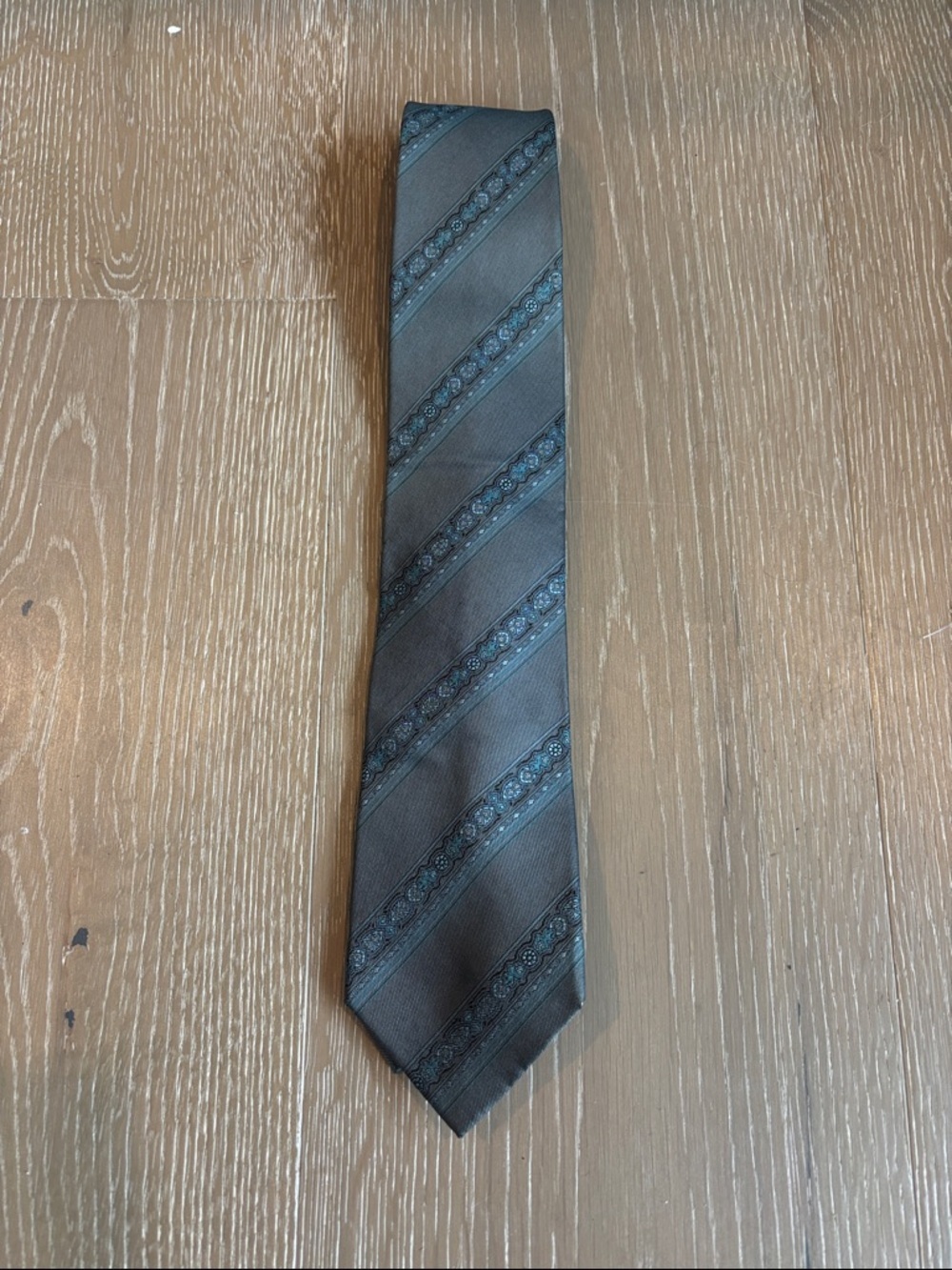 Yves Saint Laurent Men's Gray Silk Tie with Subtle Blue Stripes